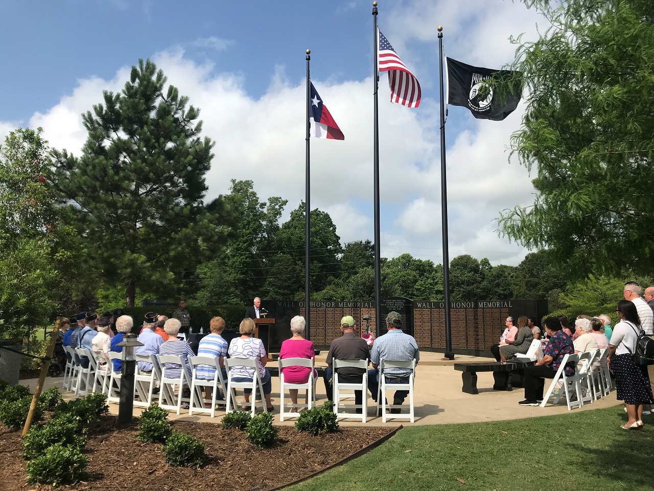 Entergy Texas' Frank Shannon addresses Dayton residents at the Wall of Honor Memorial.